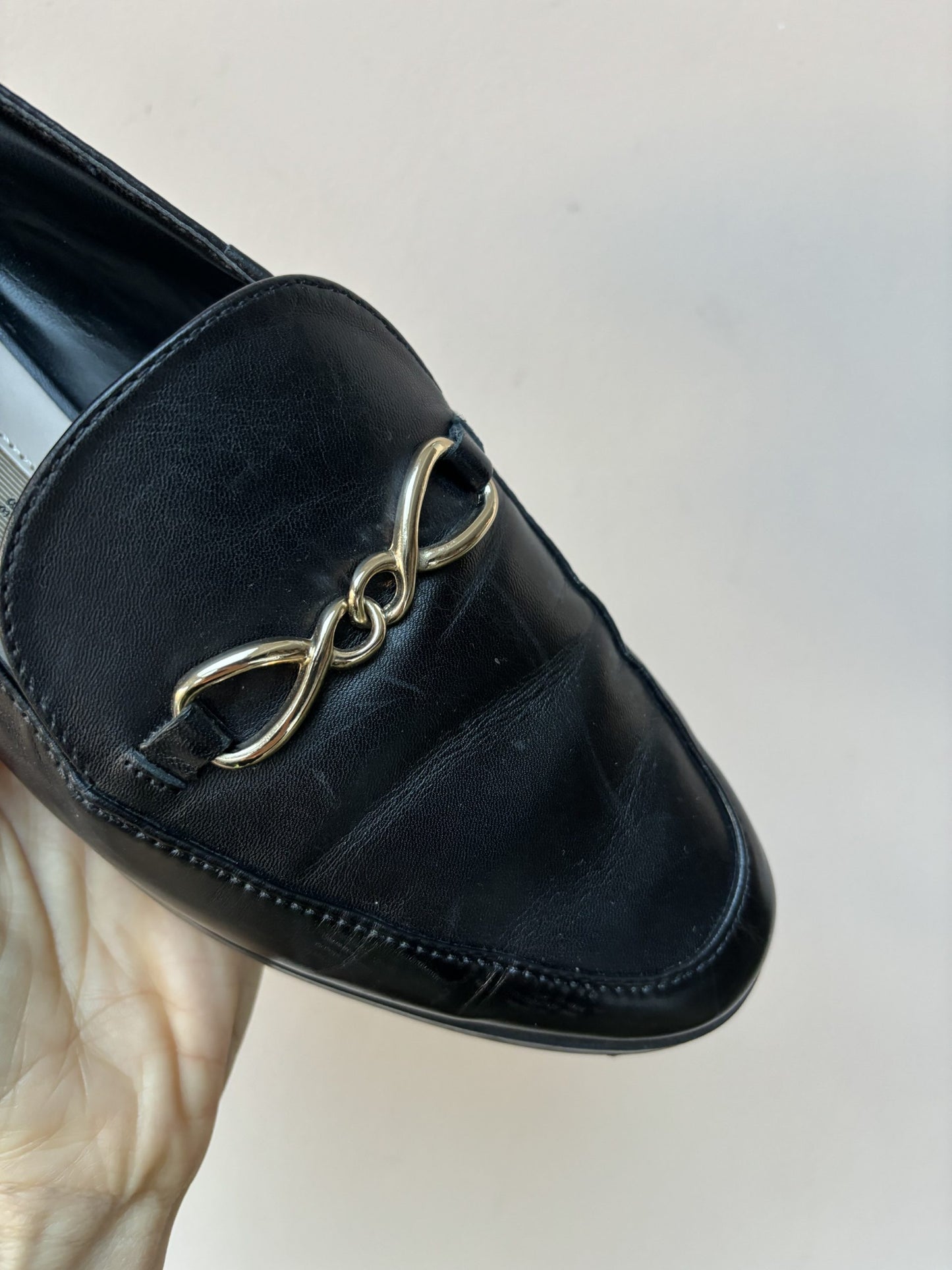 Black leather loafers with gold buckle UK5
