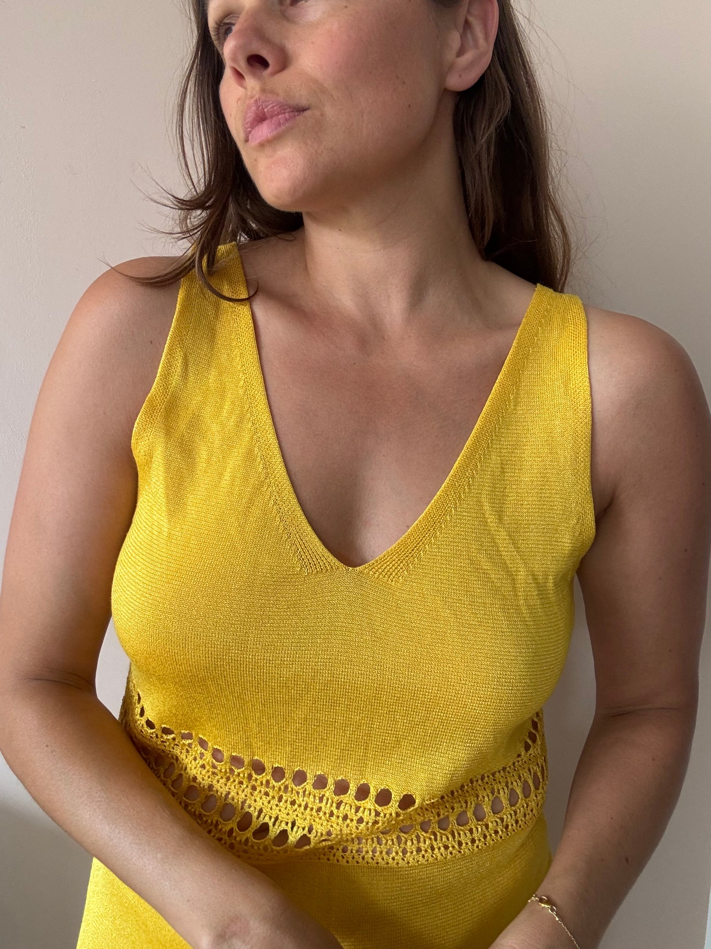Yellow fine knit dress with cut out waist size Medium