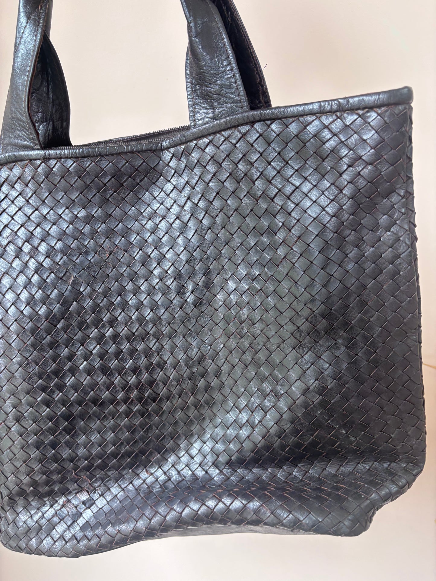 Dark brown woven leather bag