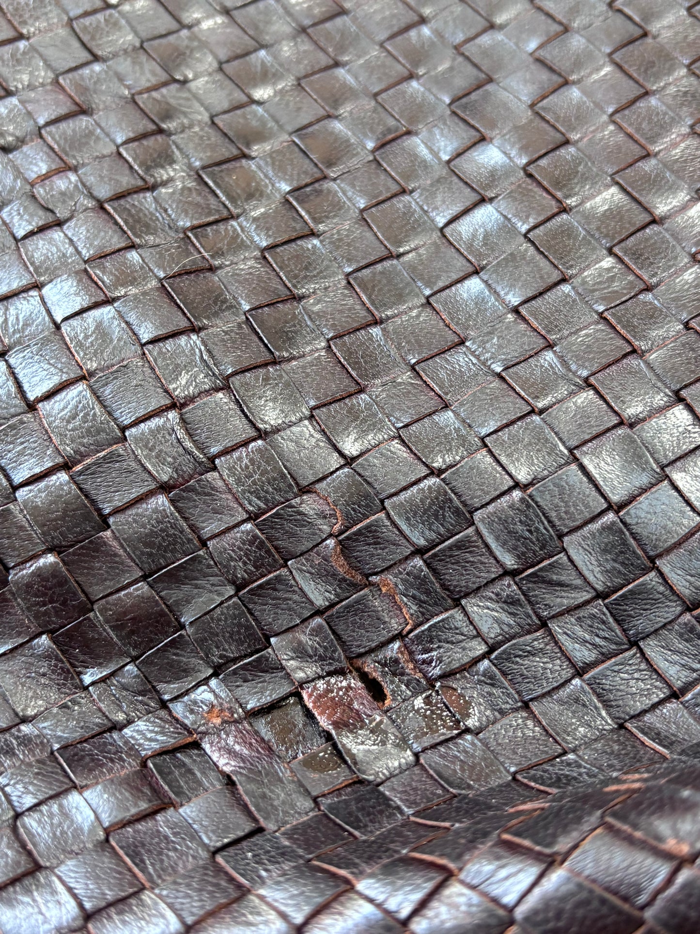 Dark brown woven leather bag