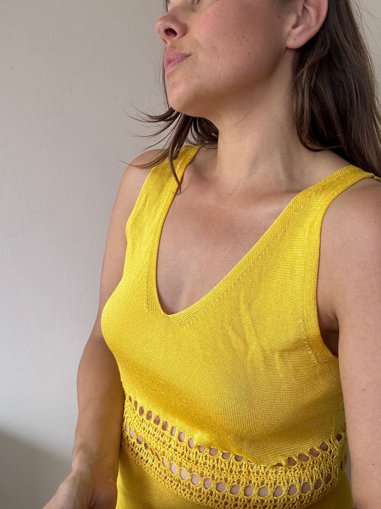 Yellow fine knit dress with cut out waist size Medium