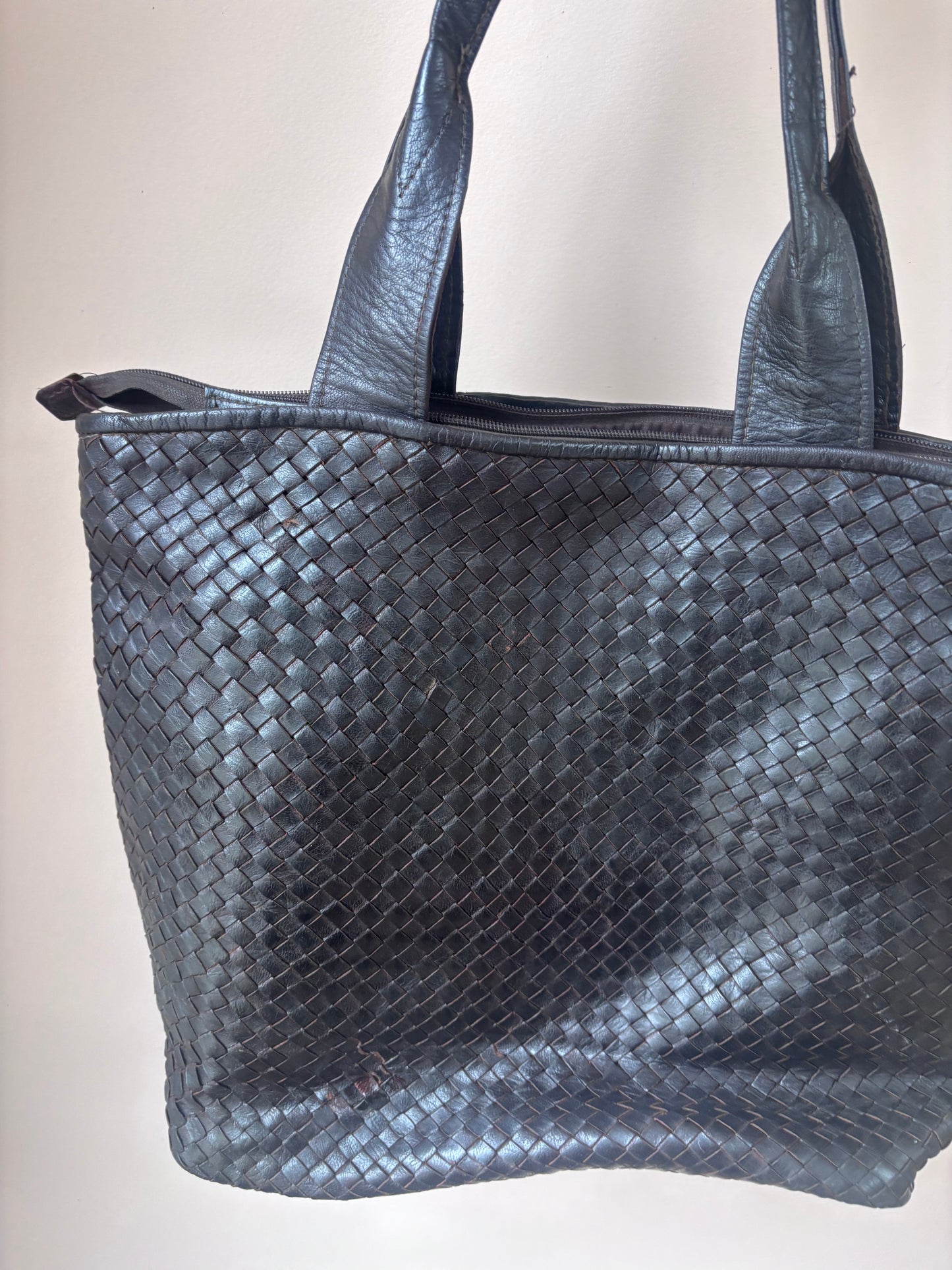 Dark brown woven leather bag