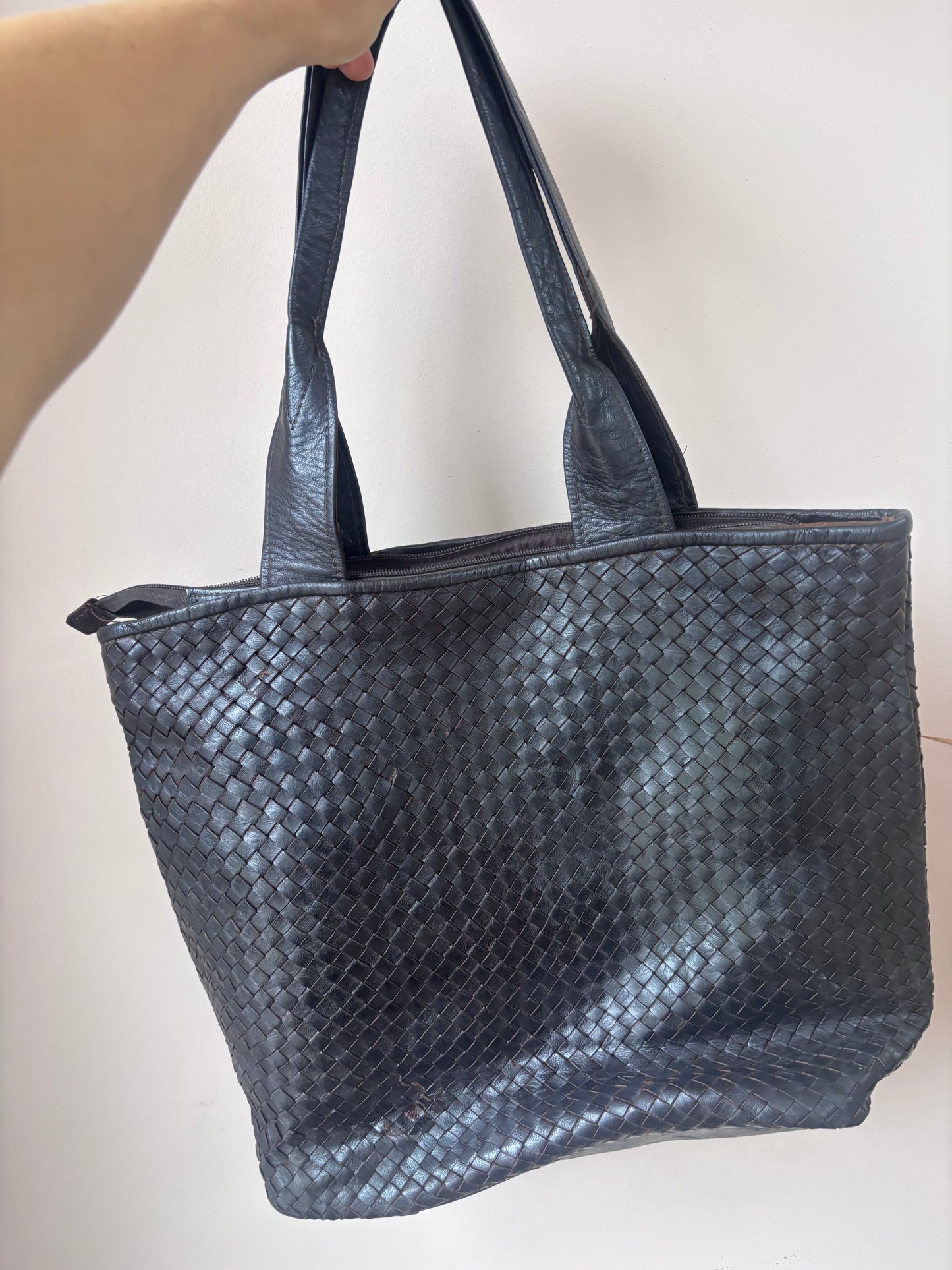 Dark brown woven leather bag