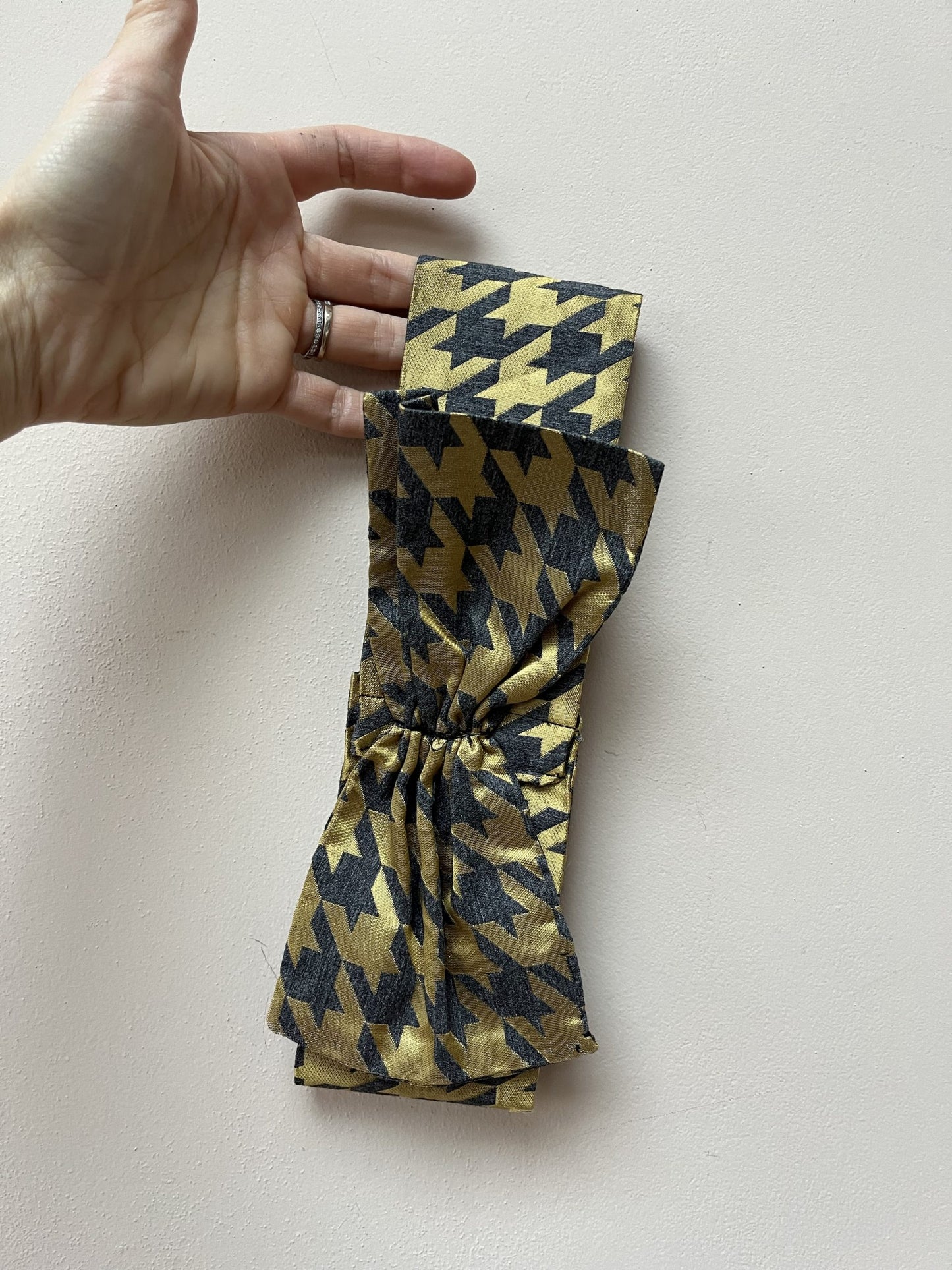 Gold and grey houndstooth headband with bow