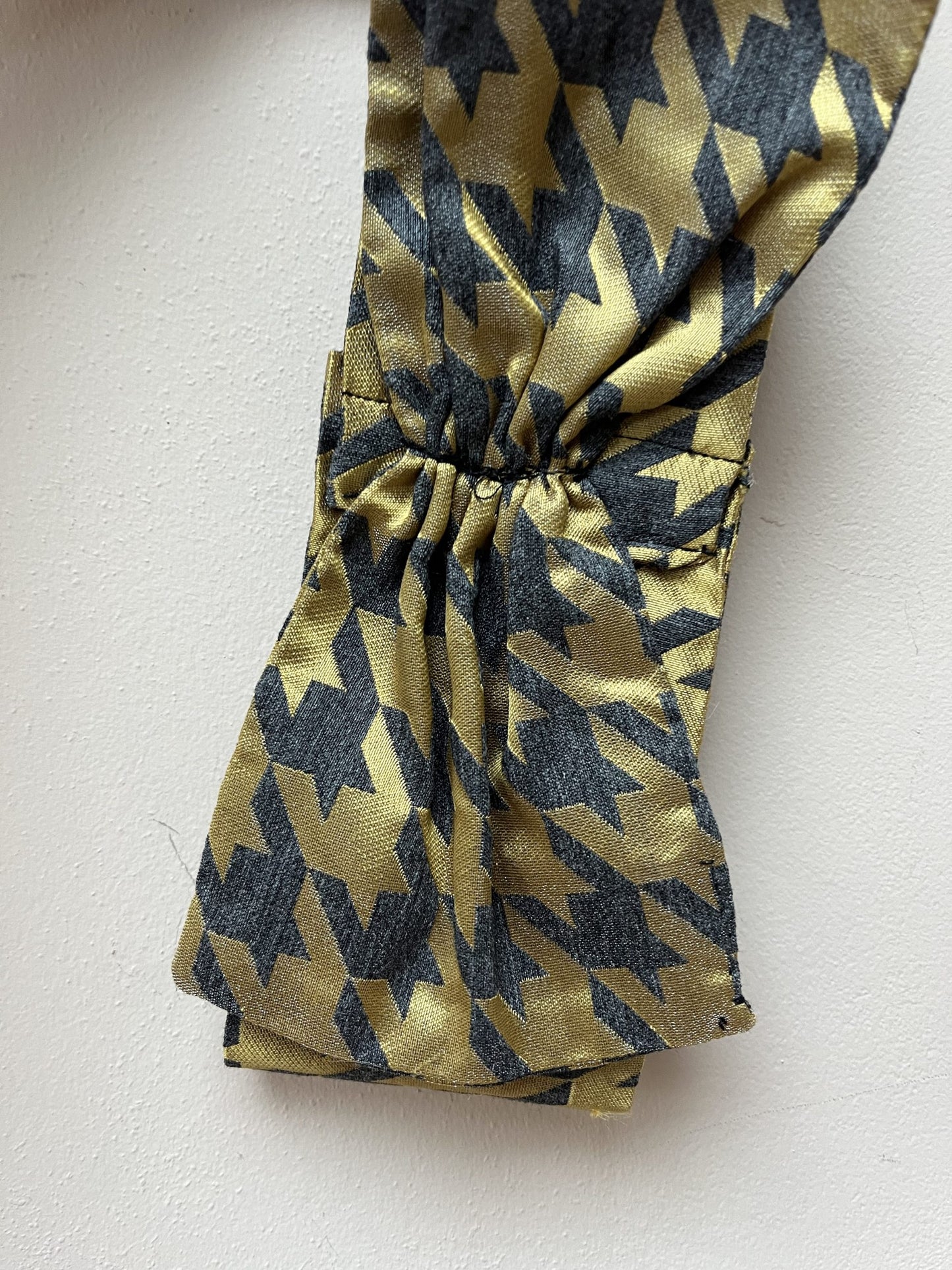 Gold and grey houndstooth headband with bow