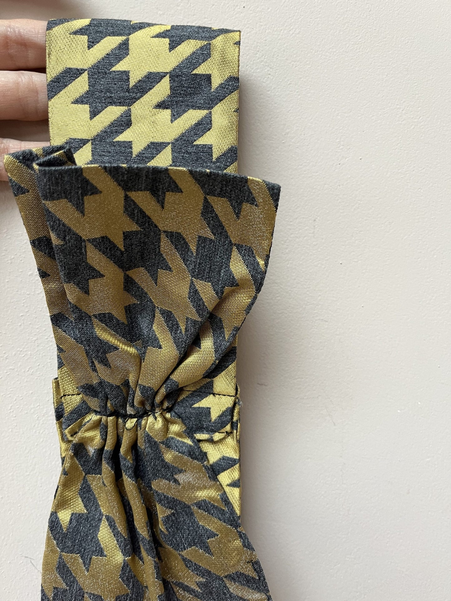 Gold and grey houndstooth headband with bow