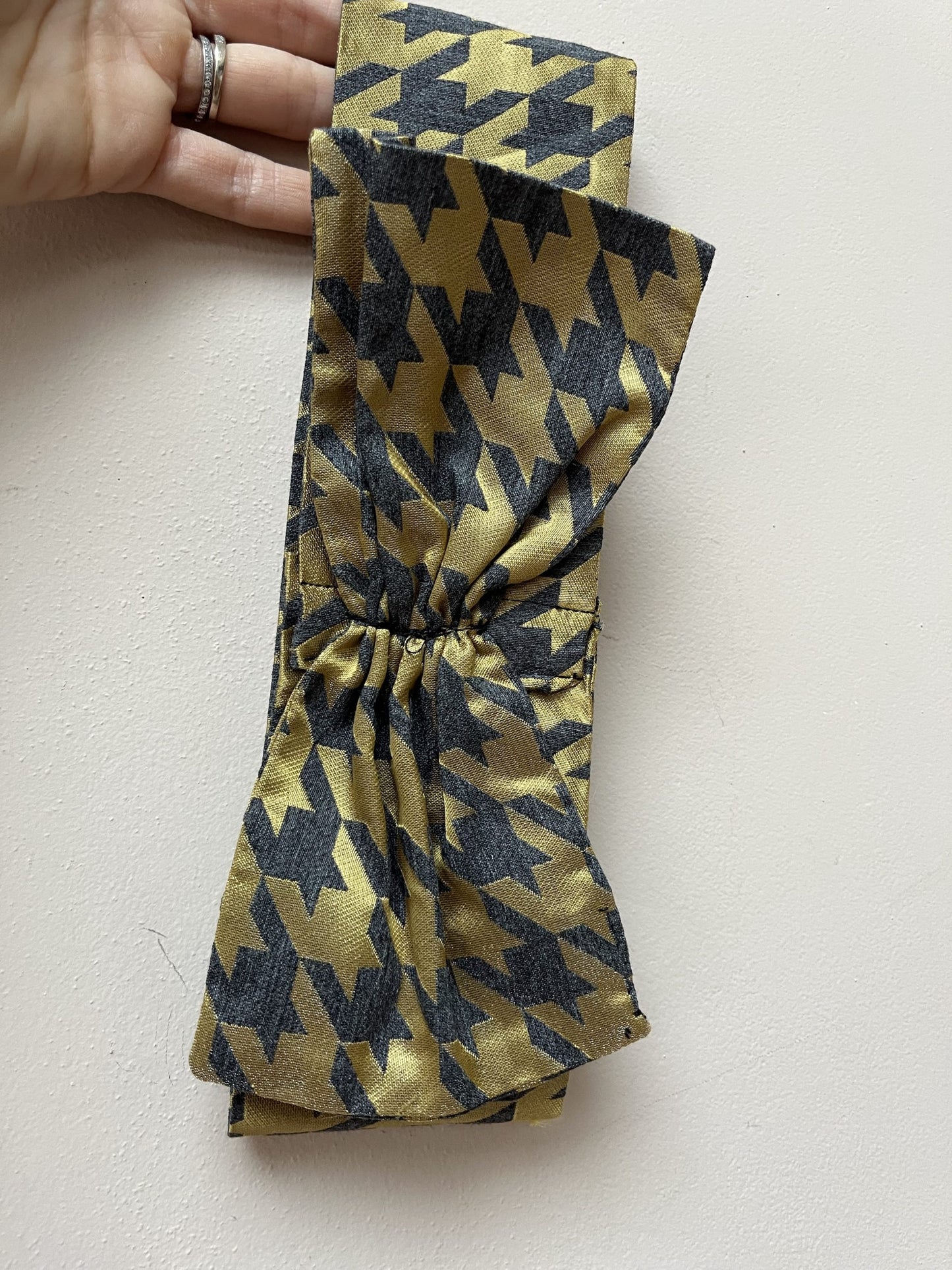Gold and grey houndstooth headband with bow