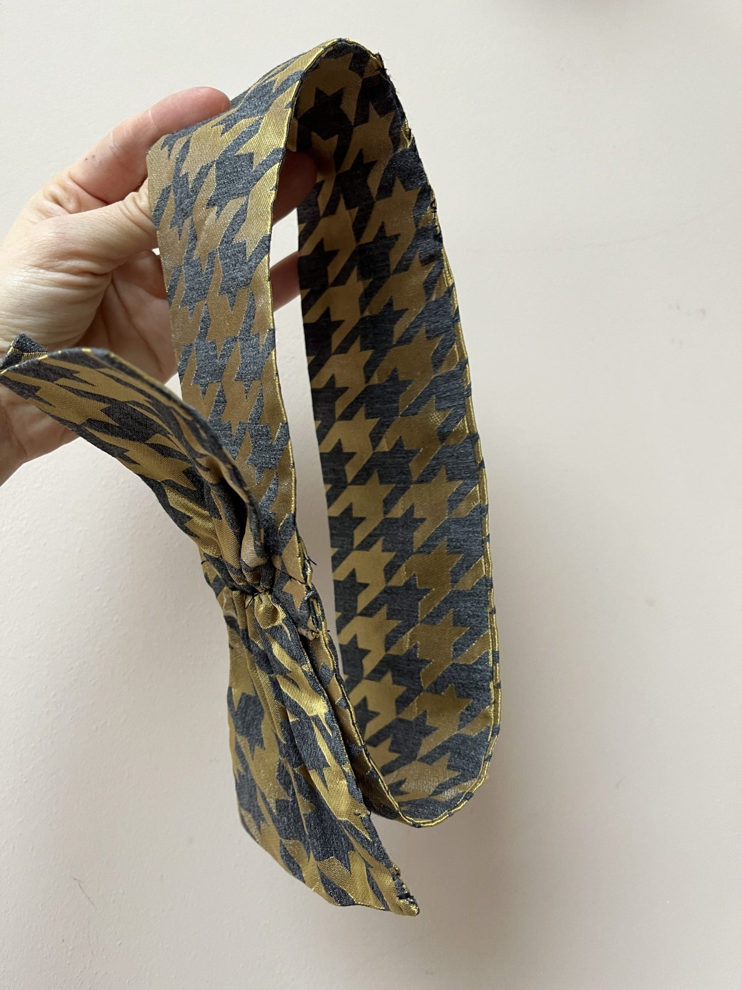 Gold and grey houndstooth headband with bow