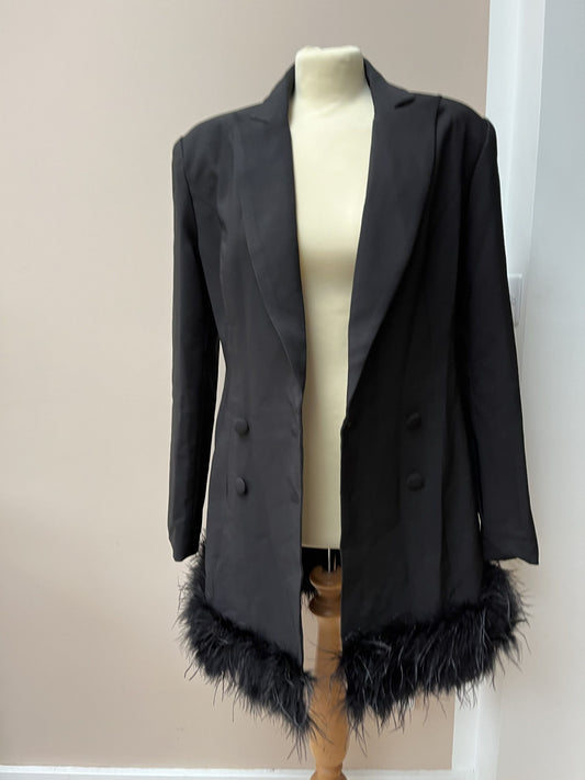 Black tuxedo style dress or jacket with feather hem. Size 12