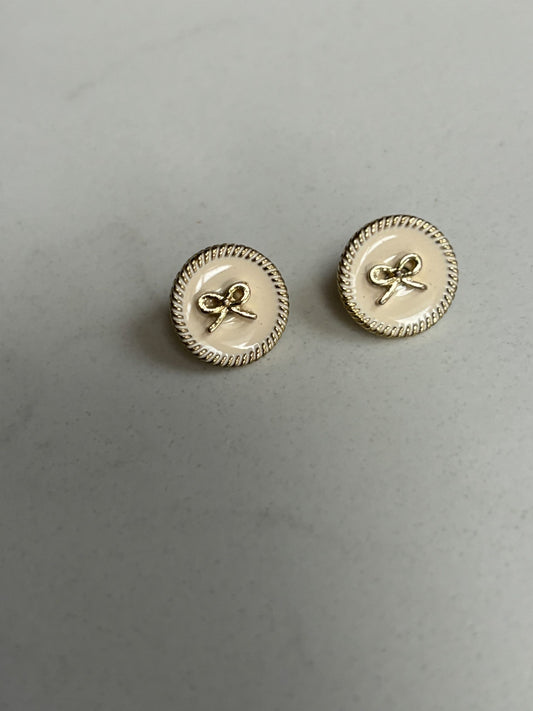 Gold bow and pale pink stud earrings