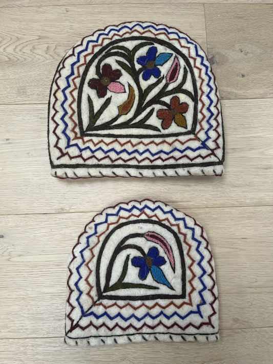 Embroidered tea cosy (one large one small)