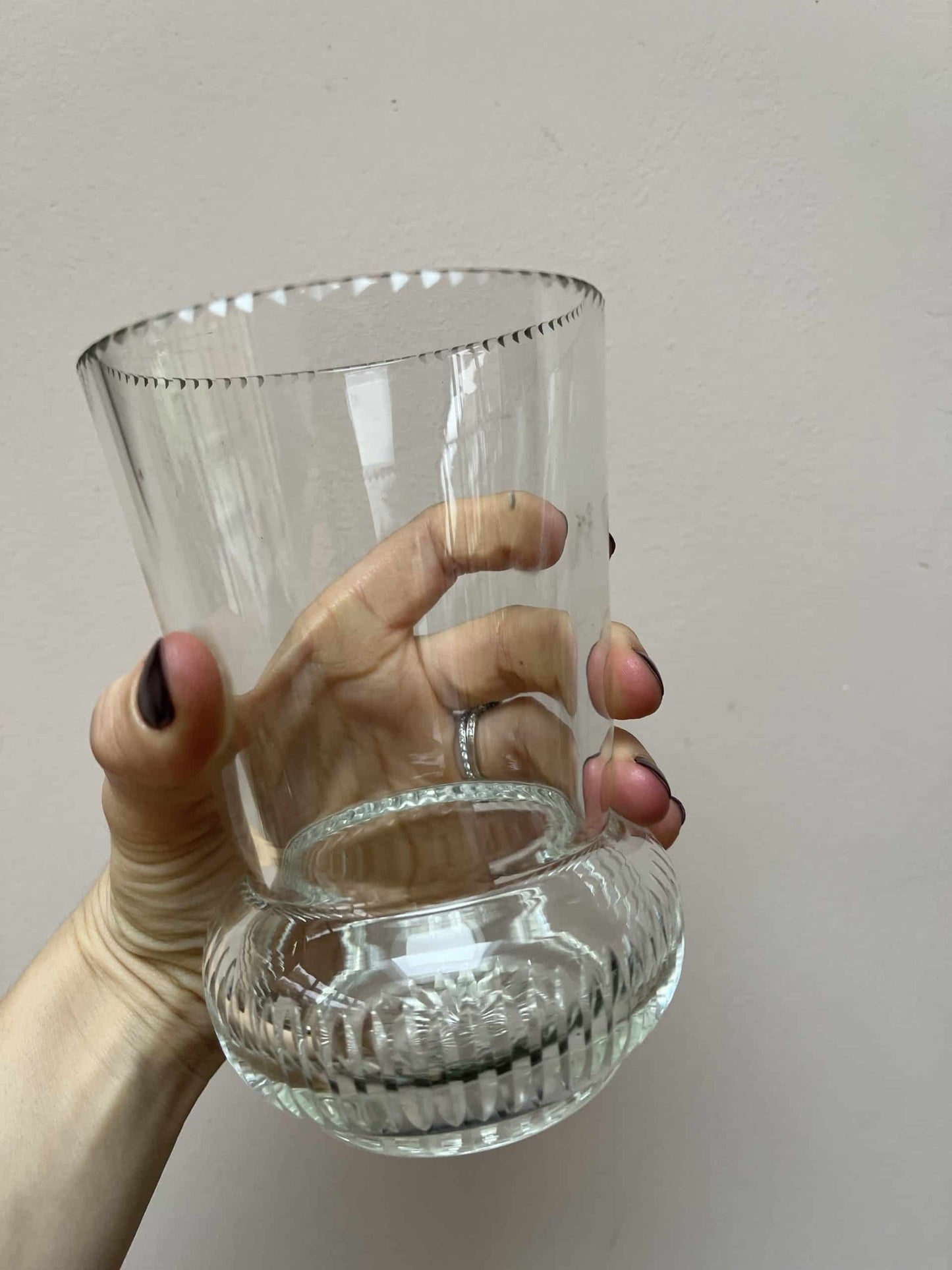 Glass vase with beautiful detailing around the rim and base