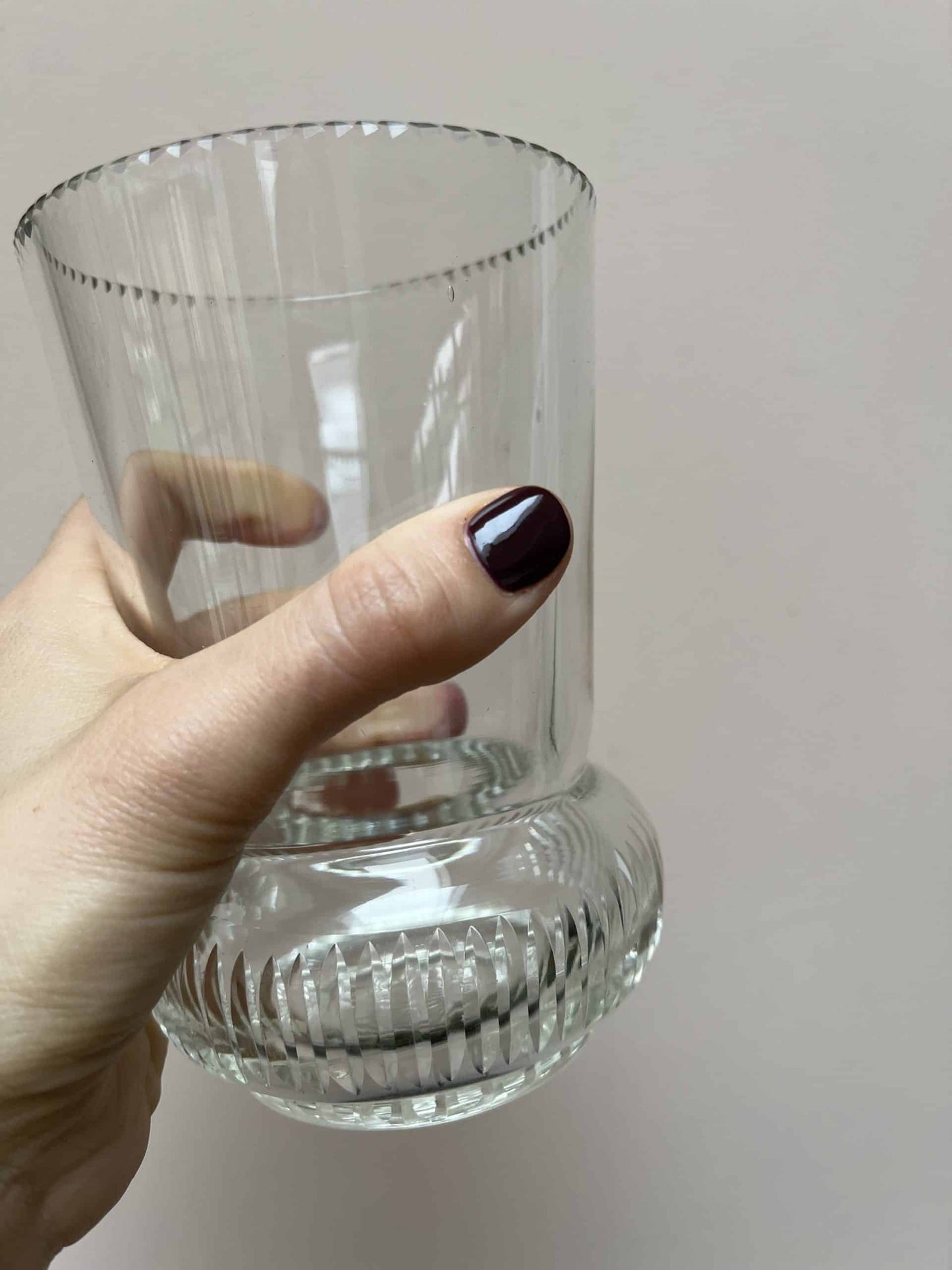 Glass vase with beautiful detailing around the rim and base