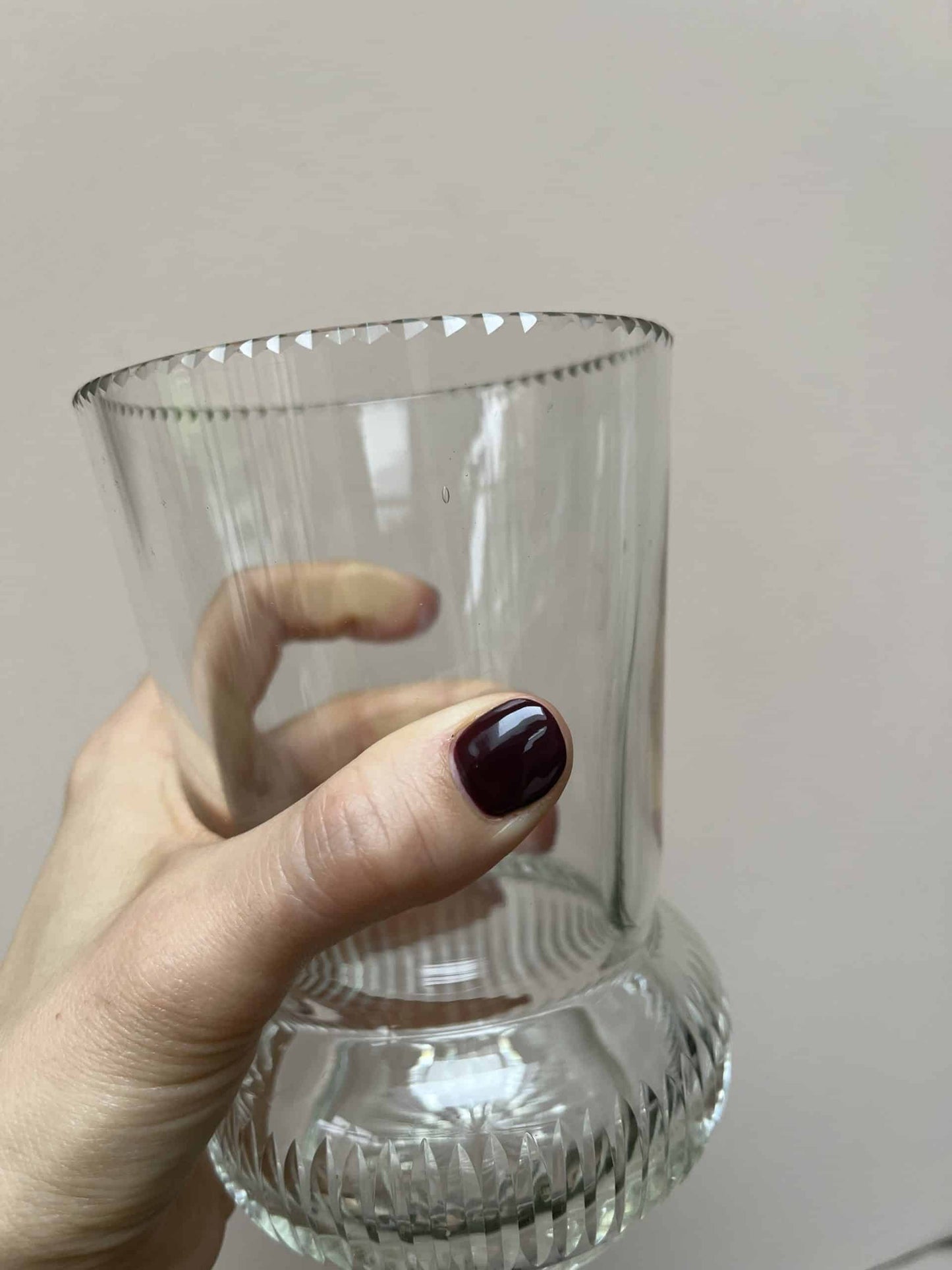 Glass vase with beautiful detailing around the rim and base