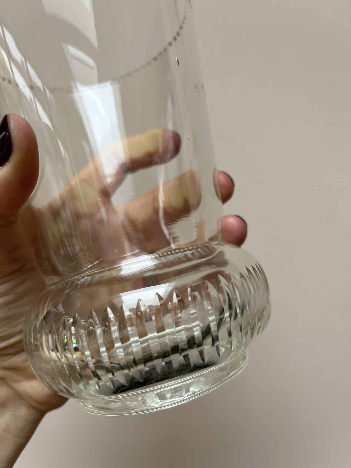 Glass vase with beautiful detailing around the rim and base