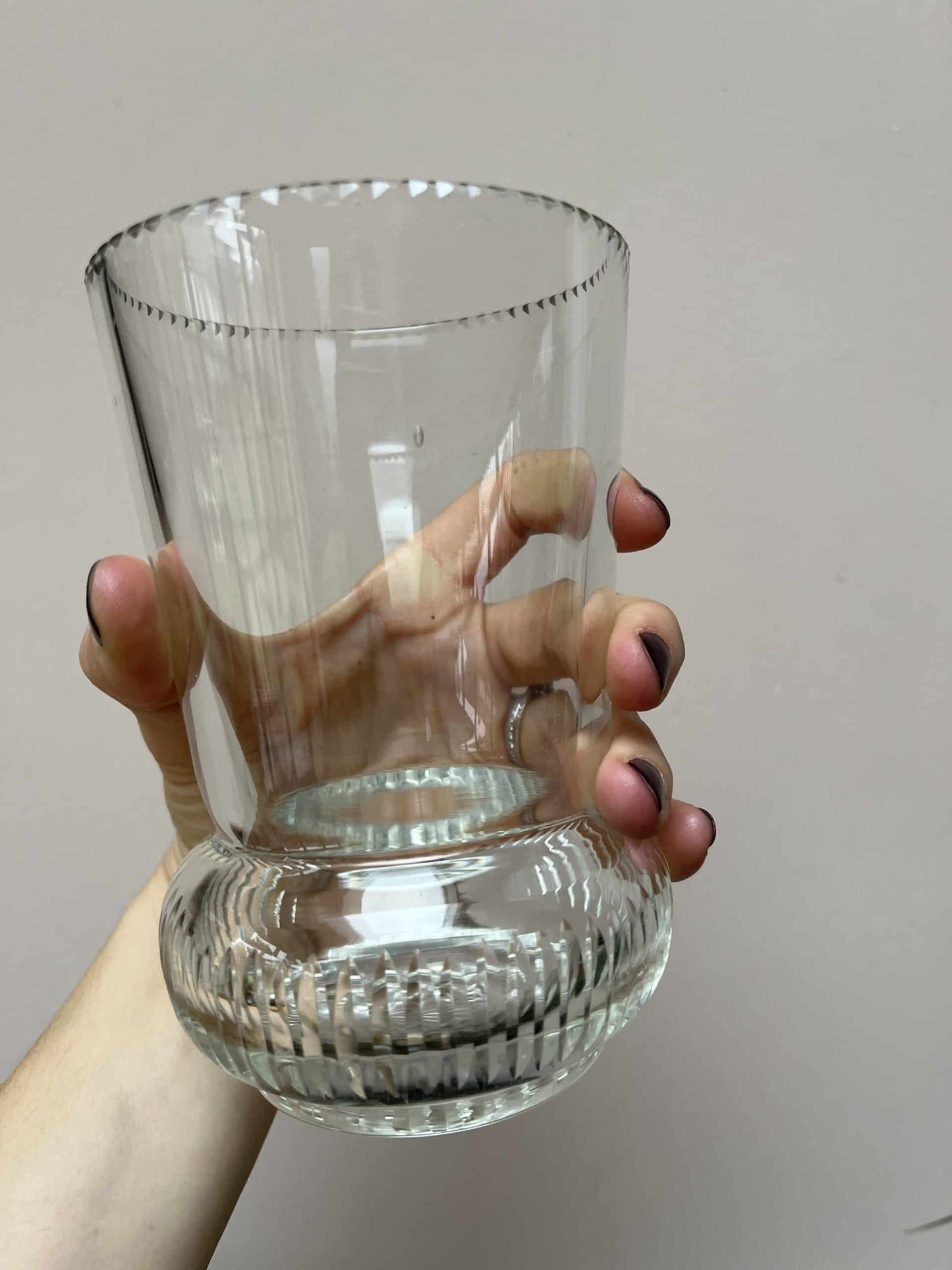 Glass vase with beautiful detailing around the rim and base