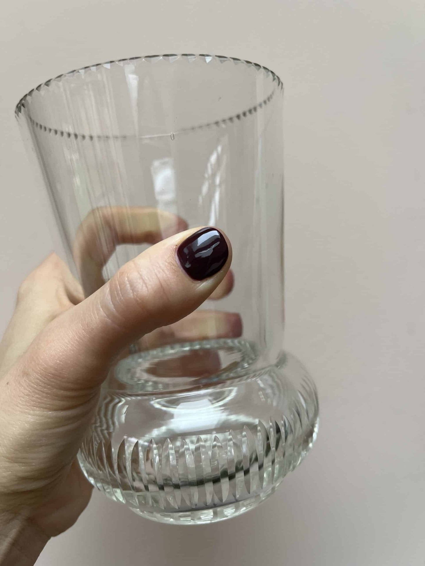 Glass vase with beautiful detailing around the rim and base