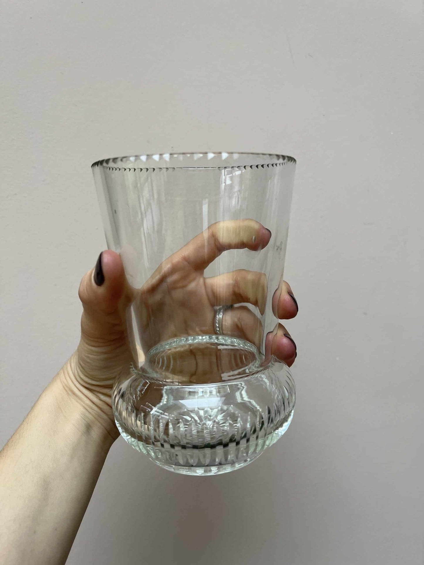 Glass vase with beautiful detailing around the rim and base