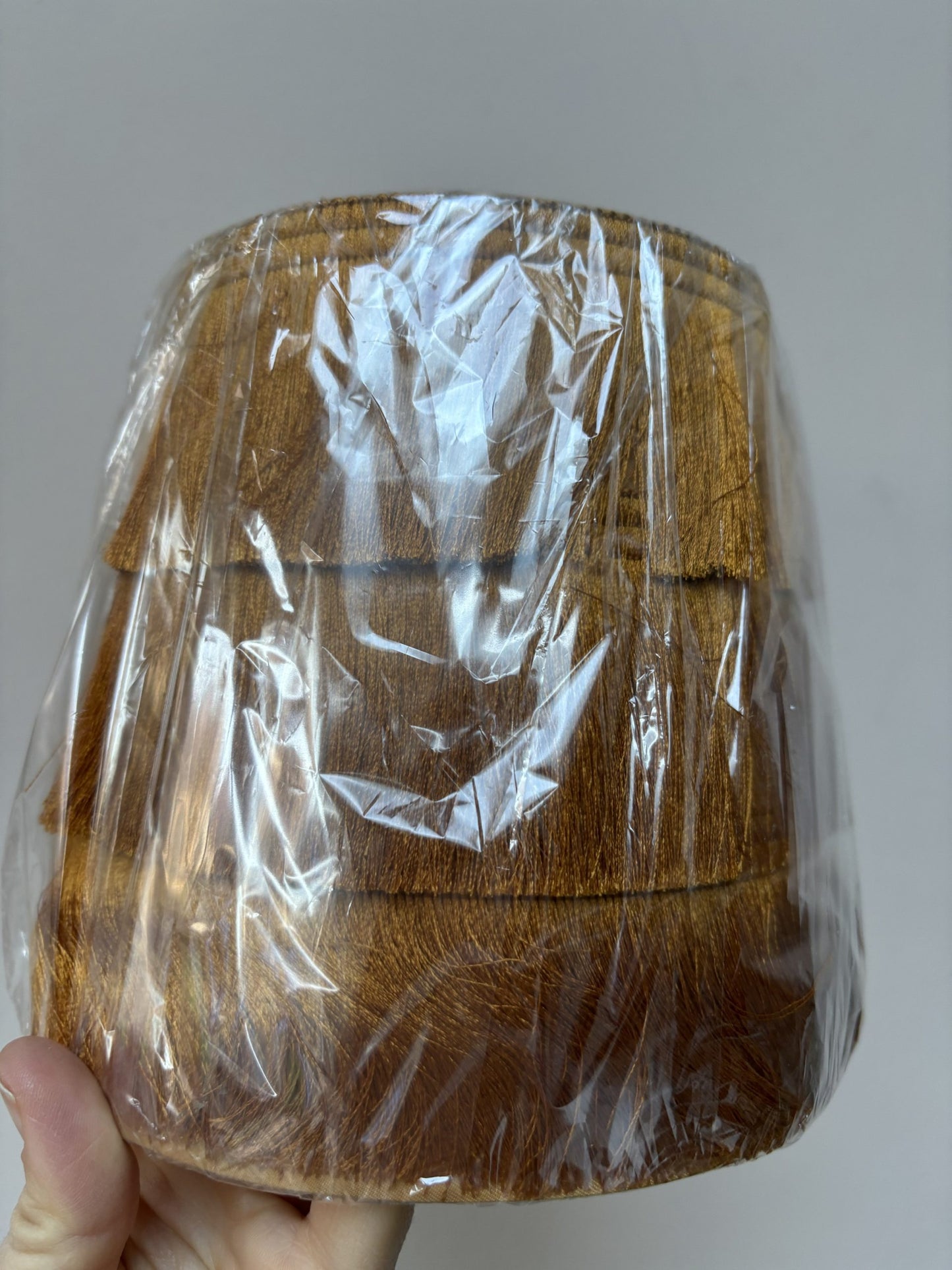 Small burnt orange fringed lampshade