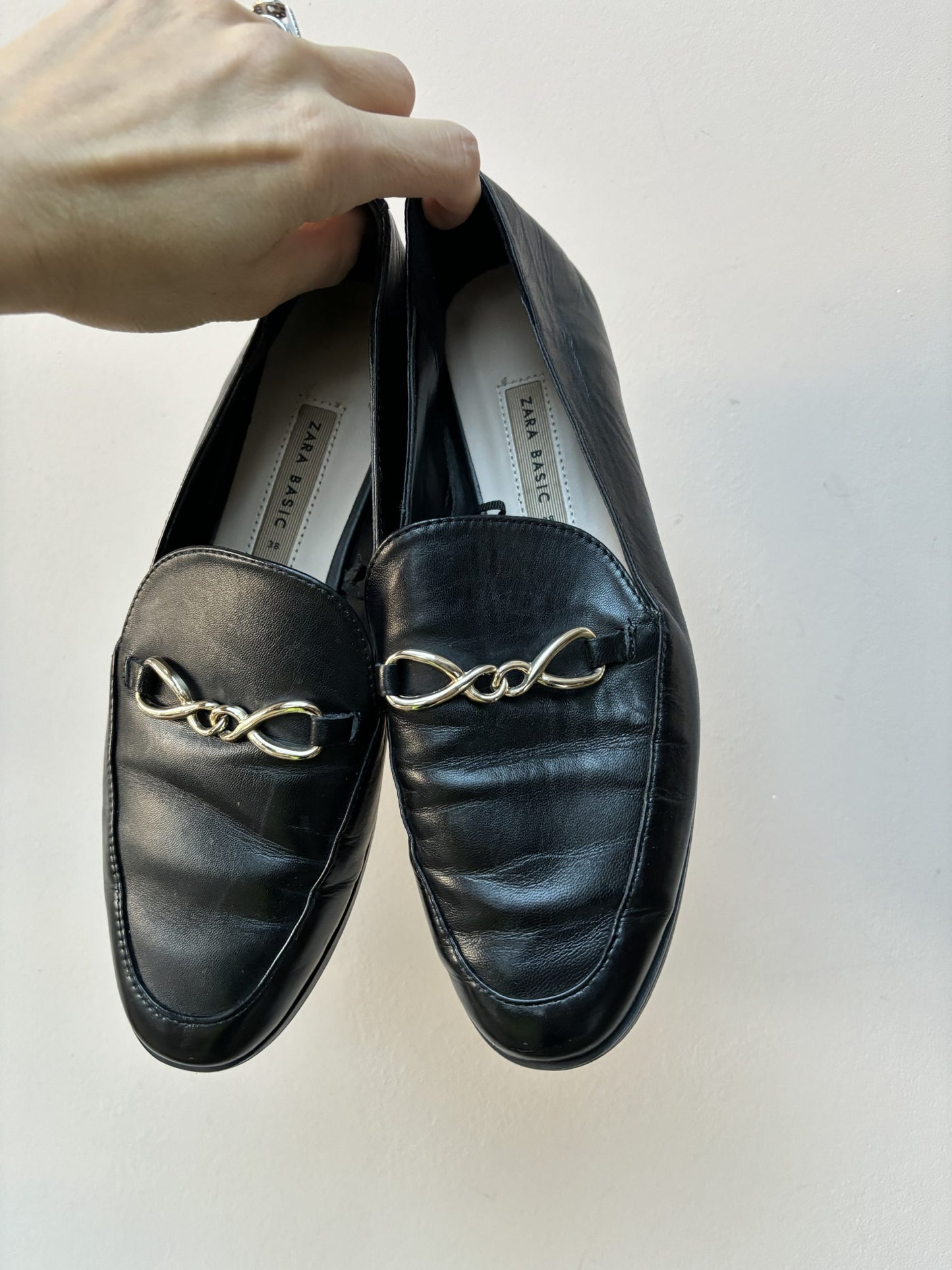 Black leather loafers with gold buckle UK5