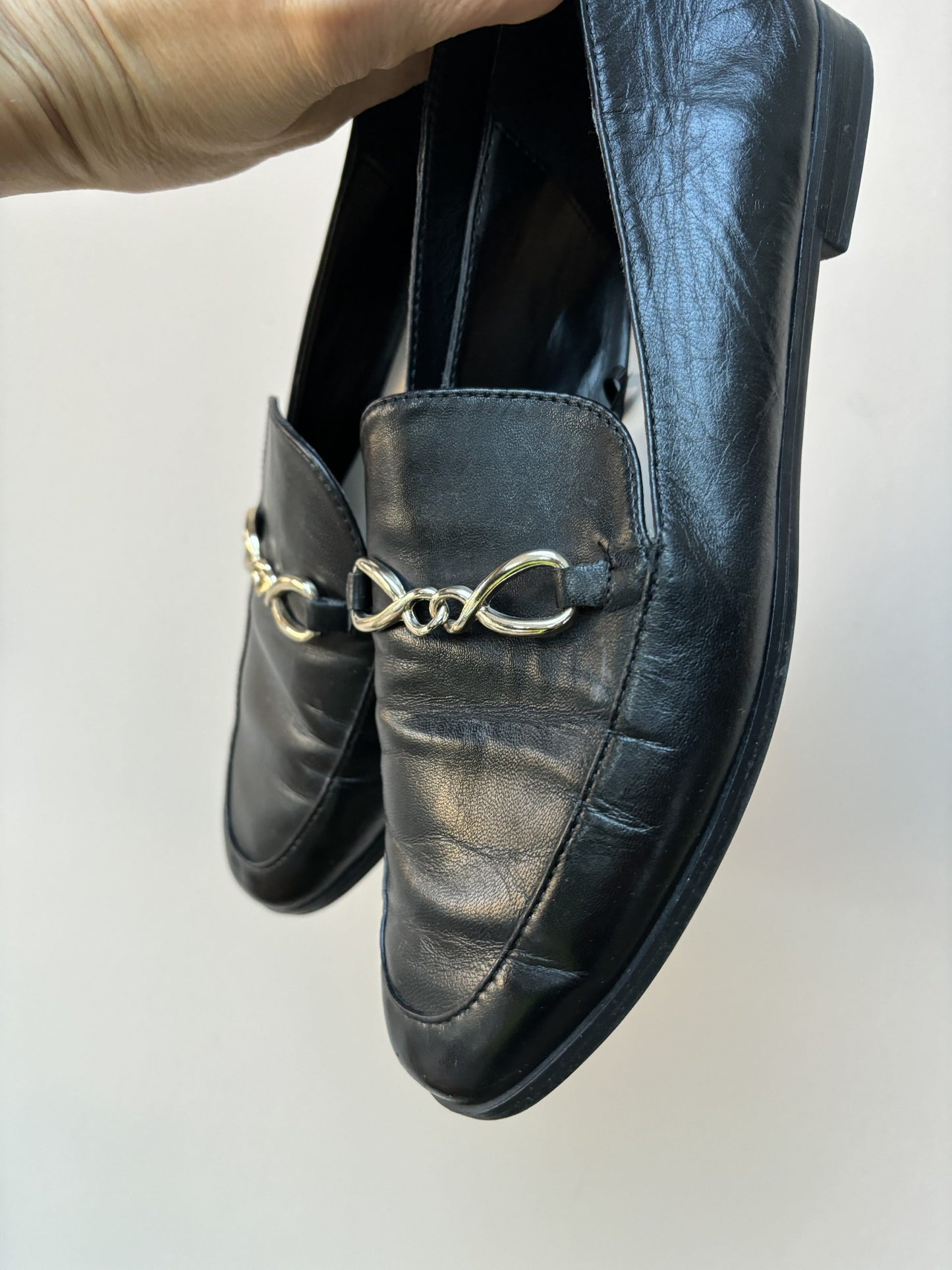 Black leather loafers with gold buckle UK5