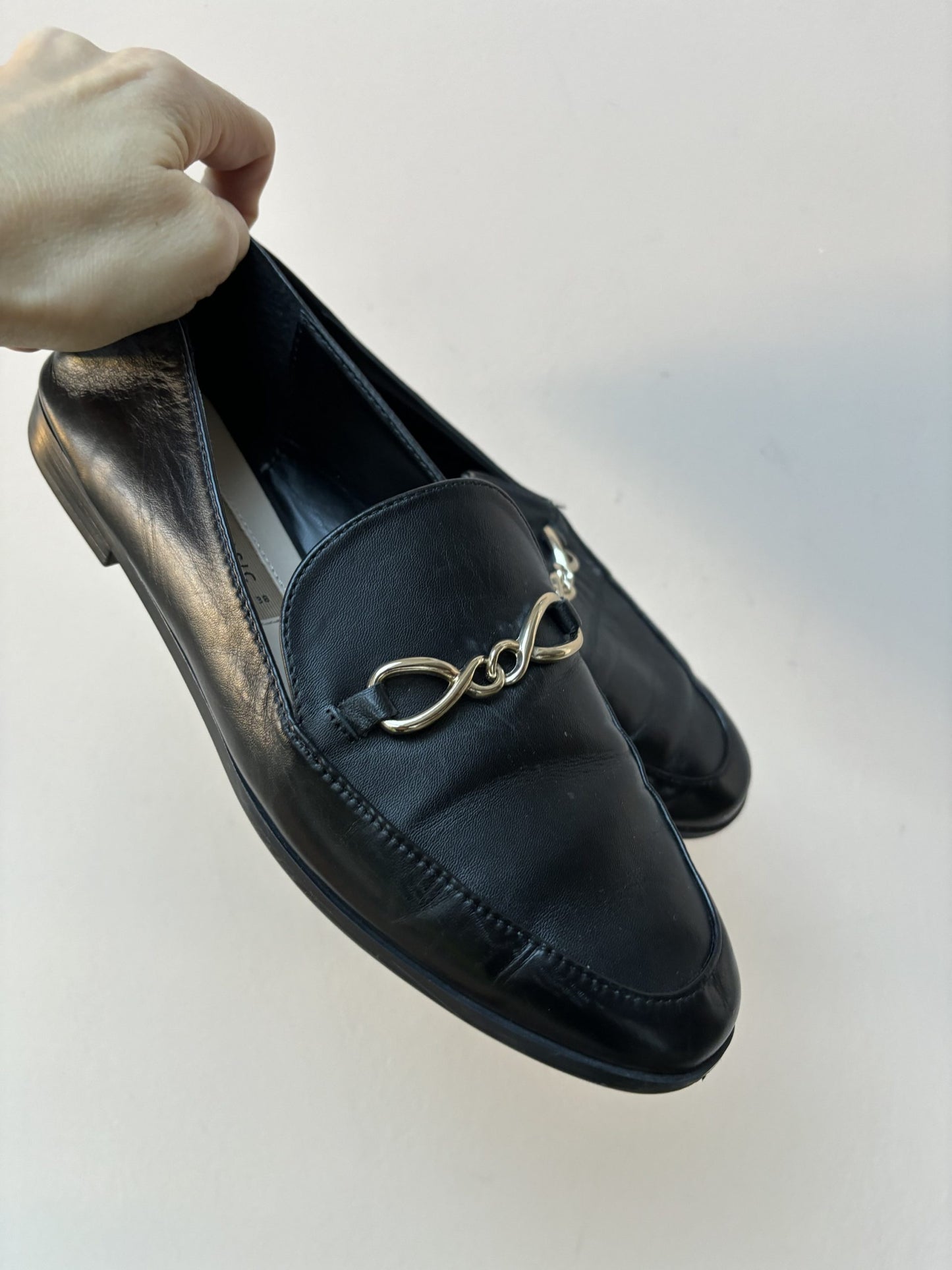 Black leather loafers with gold buckle UK5