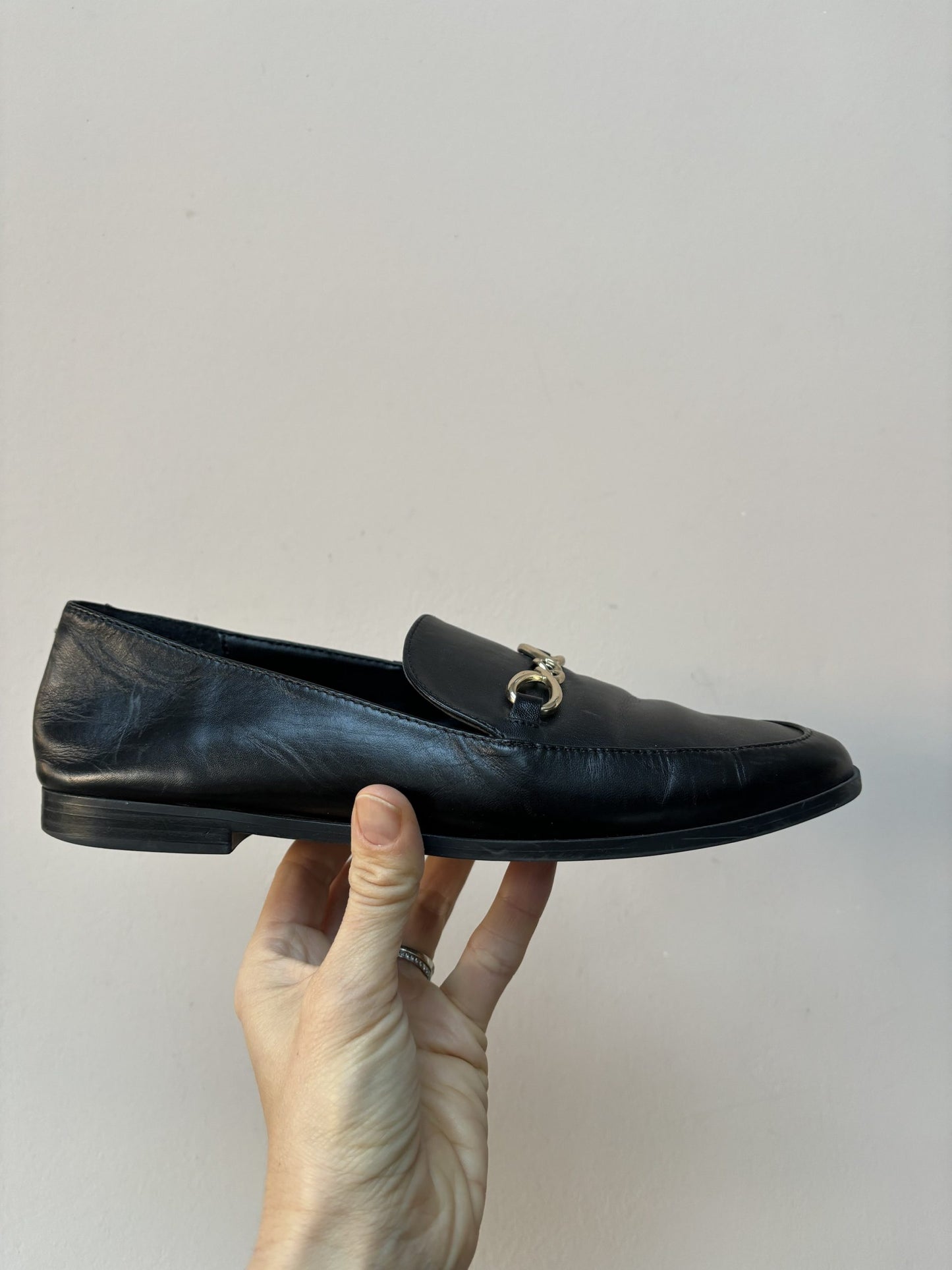 Black leather loafers with gold buckle UK5