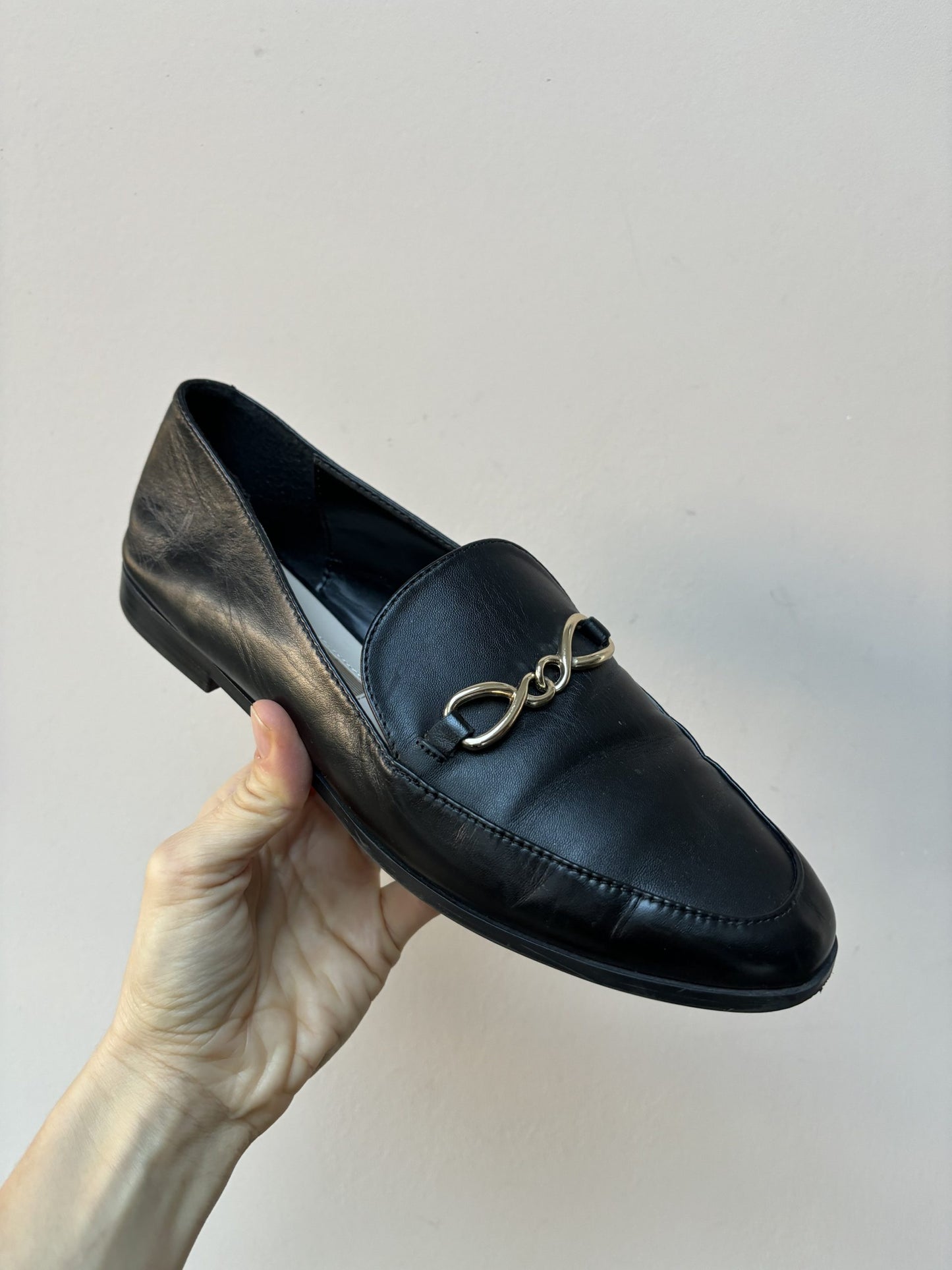 Black leather loafers with gold buckle UK5