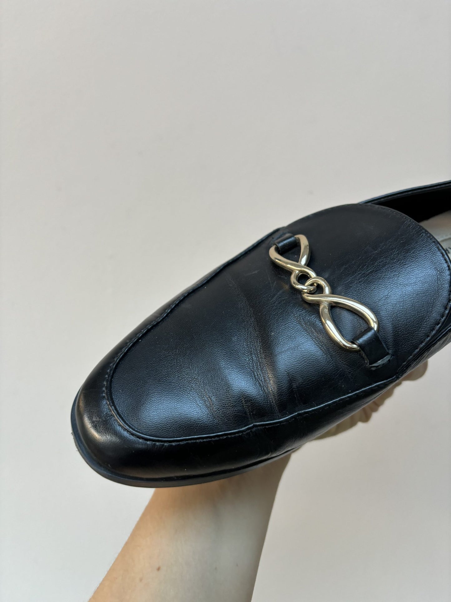 Black leather loafers with gold buckle UK5